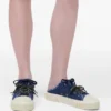 The Puffy Daisy Denim Sneaker Mule